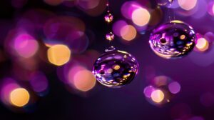 Two reflective ornaments with purple and gold bokeh background