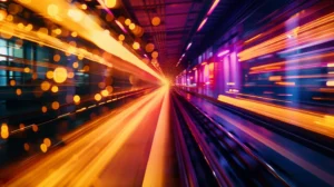 Abstract long-exposure motion blur of medical manufacturing line equipment in transit with deep violet machinery silhouettes and warm orange freight light trails crossing geographic distance